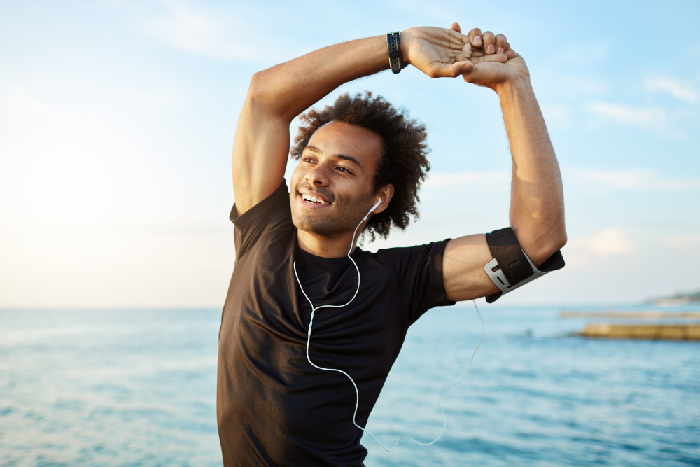 Man stretching outdoors with NAD energy boost