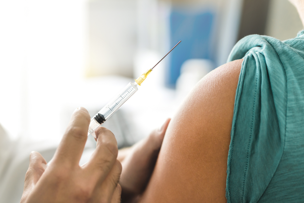 Close-up of NAD IV injection in shoulder