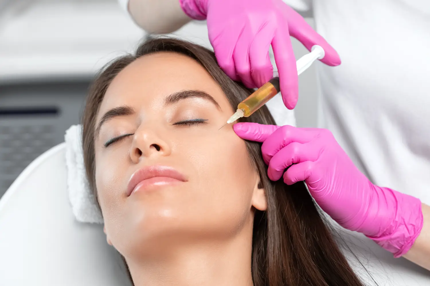practitioner performing PRF injection under eye area